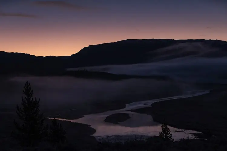 Sunset on River Valley in Rocky Mountains