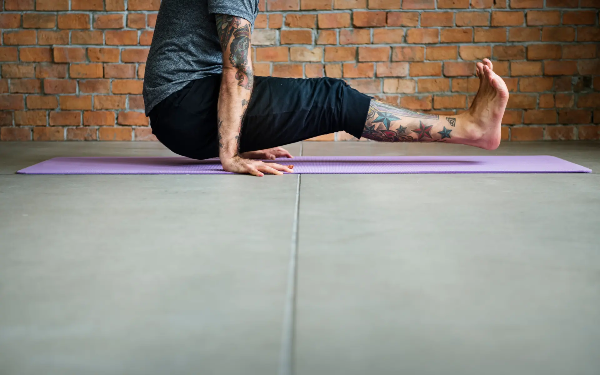 Man performing core exercise with Pilates